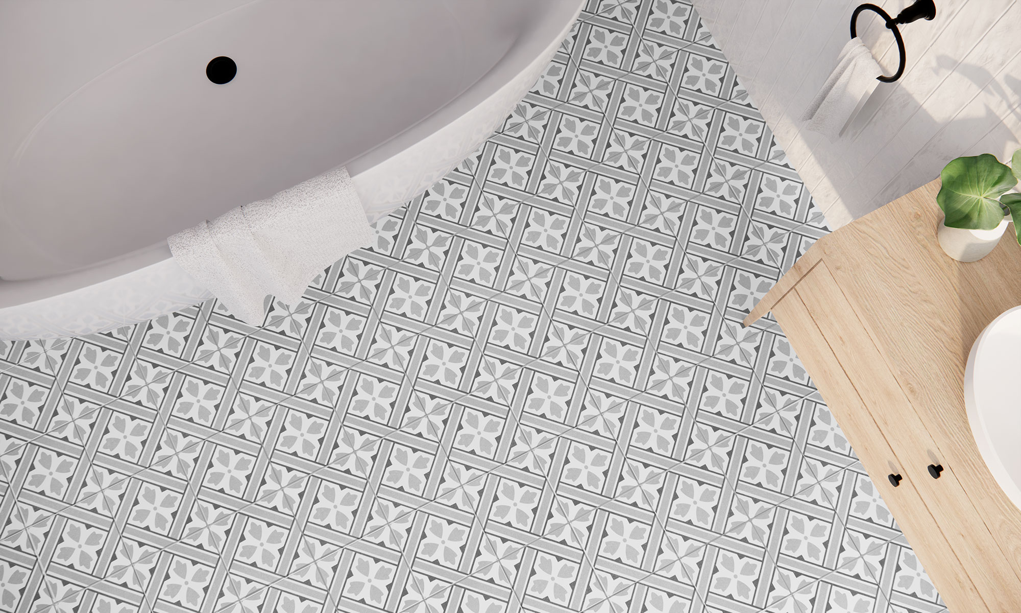 Baño con pavimento cerámico blanco y gris de motivos geométricos, bañera y mueble