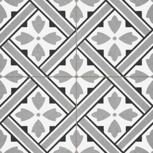 Azulejos cerámicos blancos y grises con motivos florales geométricos en patrón diagonal