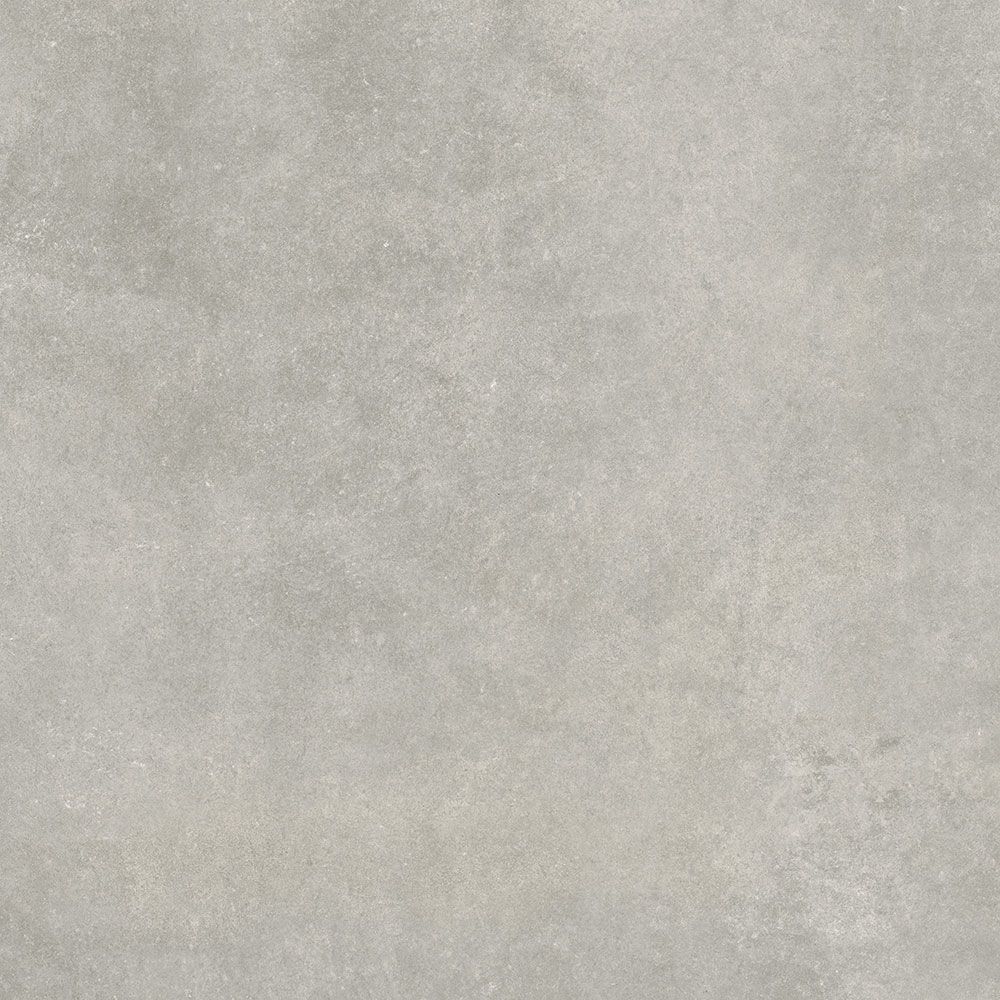Baldosa porcelánica efecto cemento gris claro, textura mate y sutiles vetas