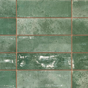 Revestimiento cerámico rectangular verde brillo con texturas y juntas marrones