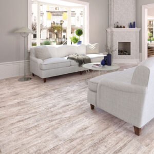 Salón con pavimento cerámico imitación madera claro, sofás blancos y chimenea.