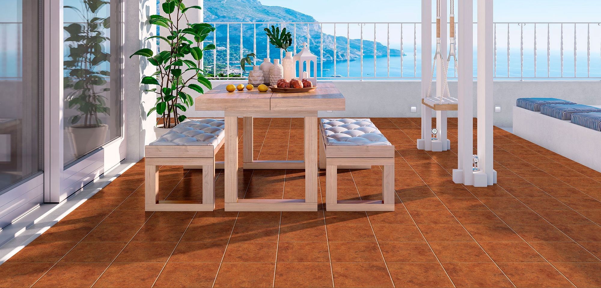 Terraza con mesa y bancos sobre pavimento cerámico marrón
