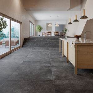 AMB-BONN-ANTRACITA-60X120-MATE Cocina y salón abiertos con pavimento cerámico gris oscuro, isla de madera y grandes ventanales