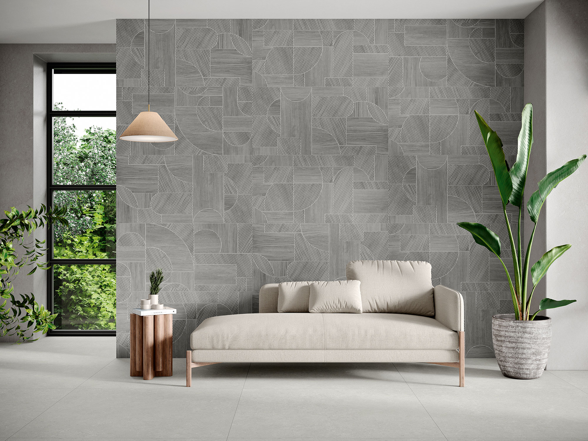 Sala de exposición con pared cerámica gris geométrica, sofá beige y suelo de pavimento cerámico
