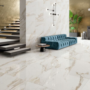 Showroom con suelos y revestimientos cerámicos efecto mármol, sofá turquesa y escalera flotante