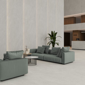 HALTON-GREY-120X280-+-60X120 Tienda de azulejos con suelos y revestimiento cerámico gris, sofás verdes y mostrador