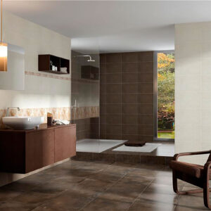 Baño expositor con pavimento marrón, azulejos beige, mueble auxiliar y ducha.